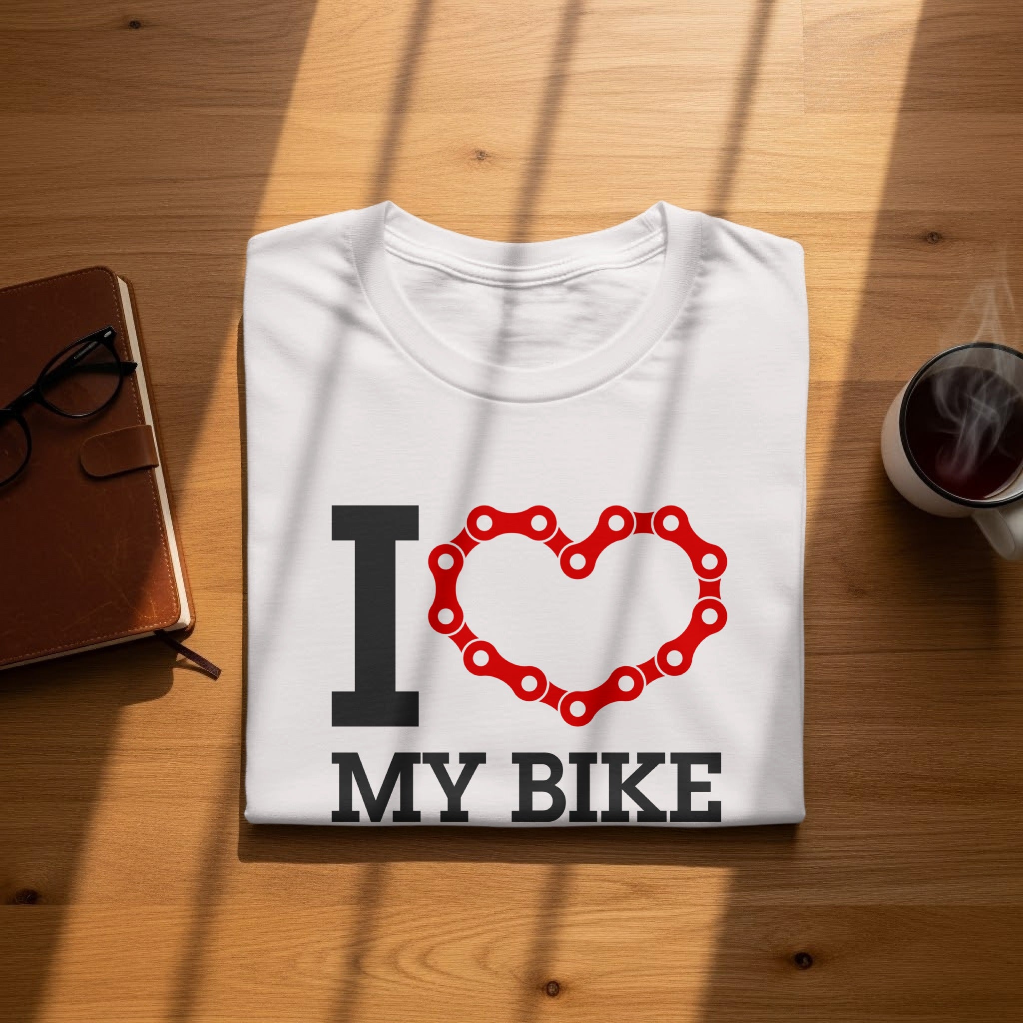 White t-shirt with "I ❤️ MY BIKE" text and a bicycle chain heart graphic.