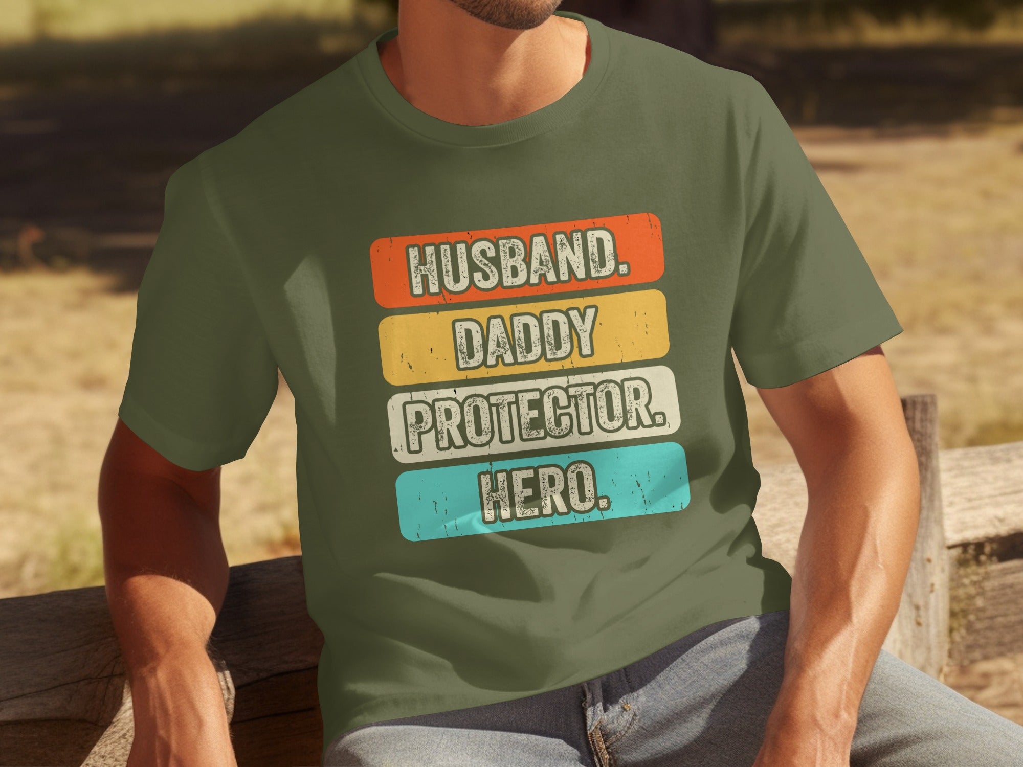 Green t-shirt with text: Husband. Daddy. Protector. Hero.