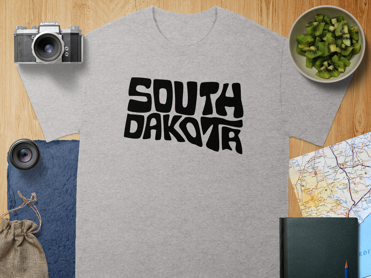 Grey t-shirt with black "South Dakota" text in a wavy font.
