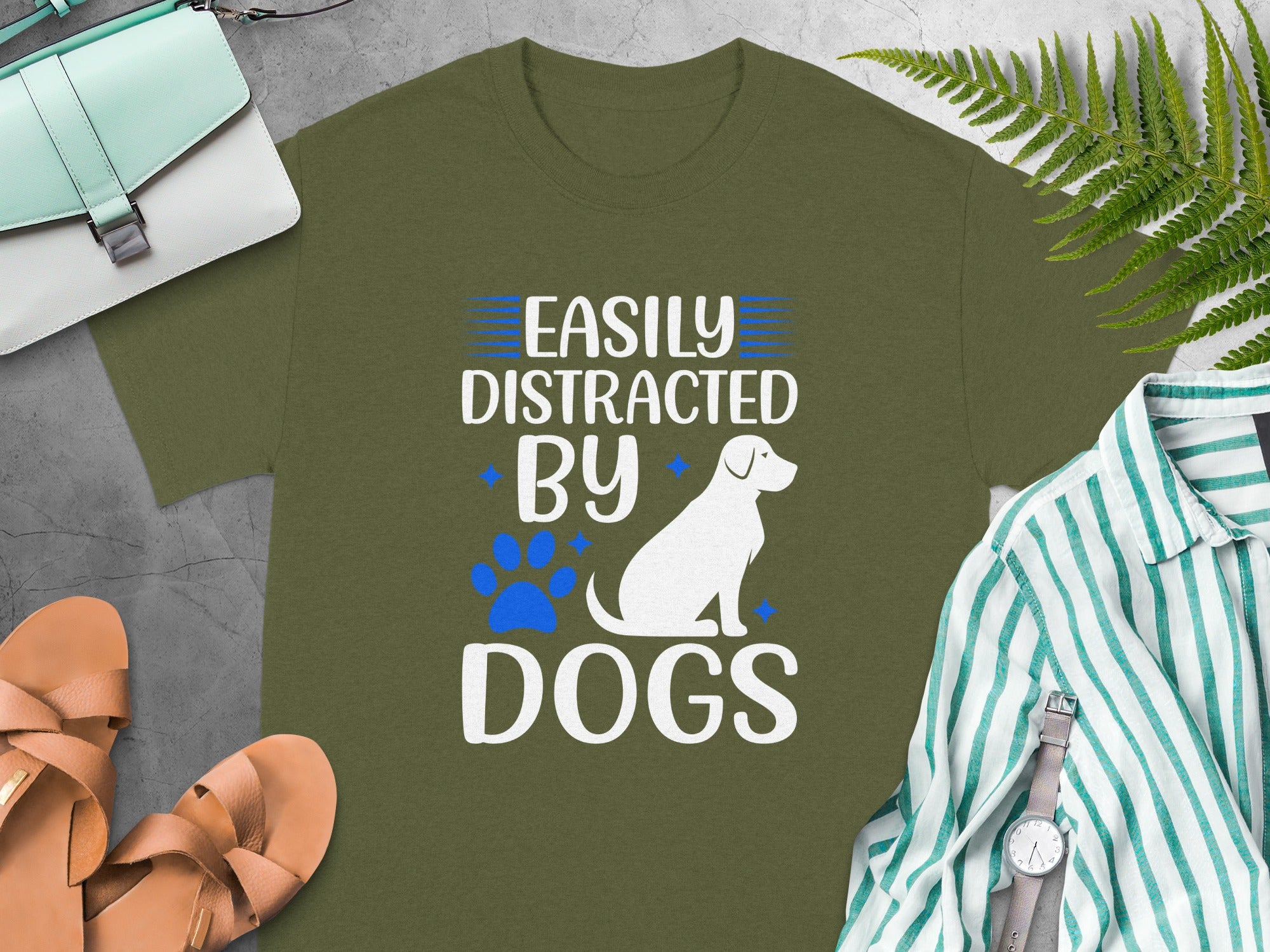 Olive green t-shirt with white text "Easily Distracted By Dogs", a dog silhouette.