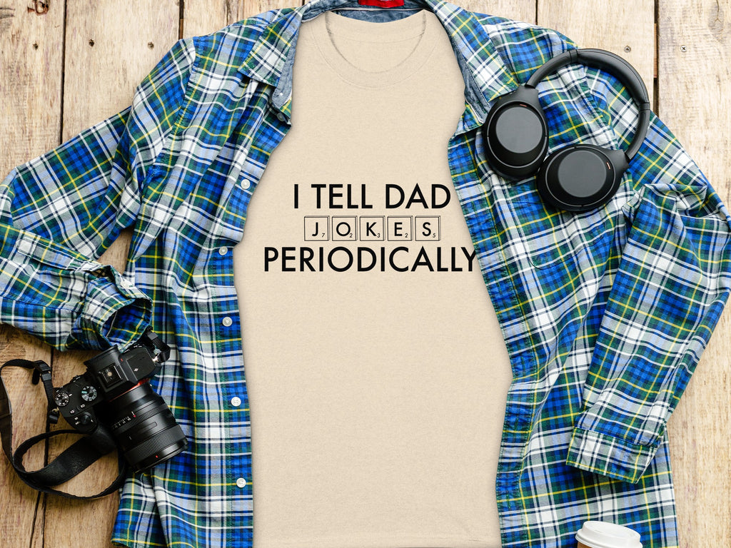 Cream t-shirt with "I TELL DAD JOKES PERIODICALLY" in black text.