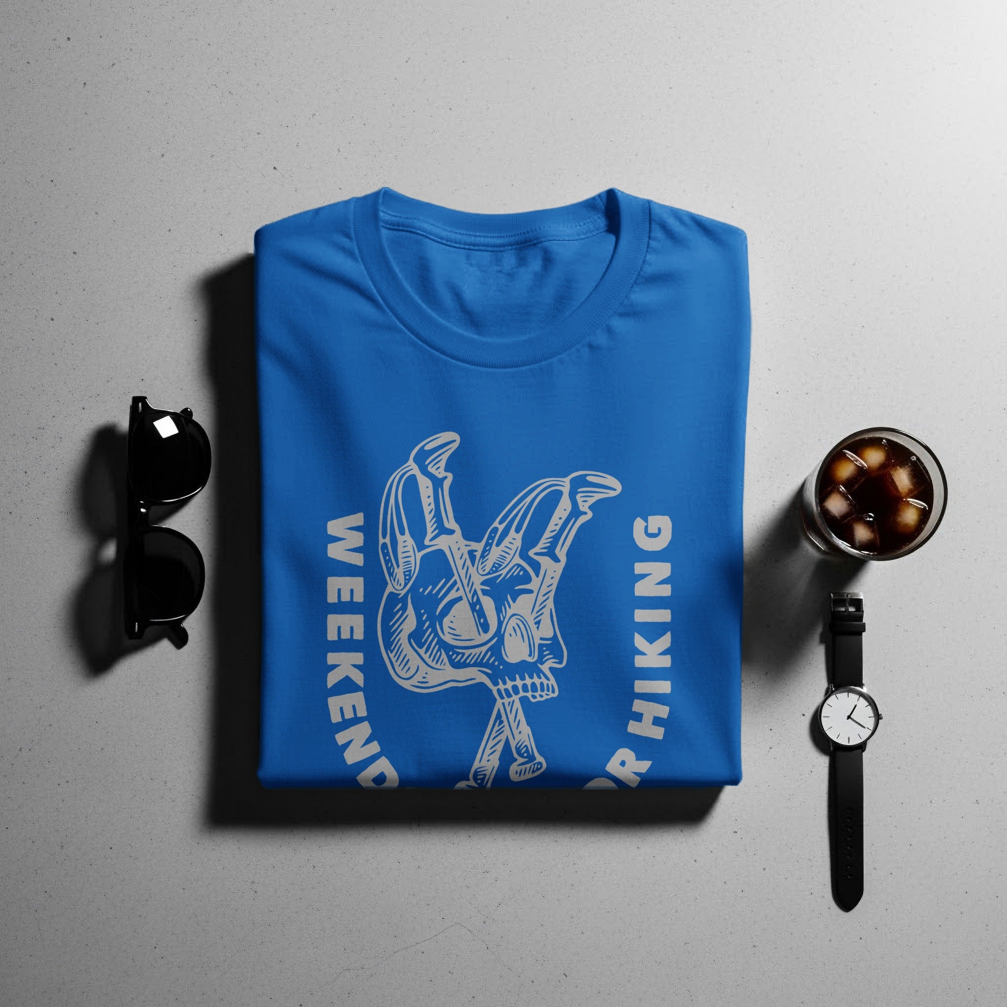 Blue t-shirt with "Weekend" and "Hiking" text and skull graphic.