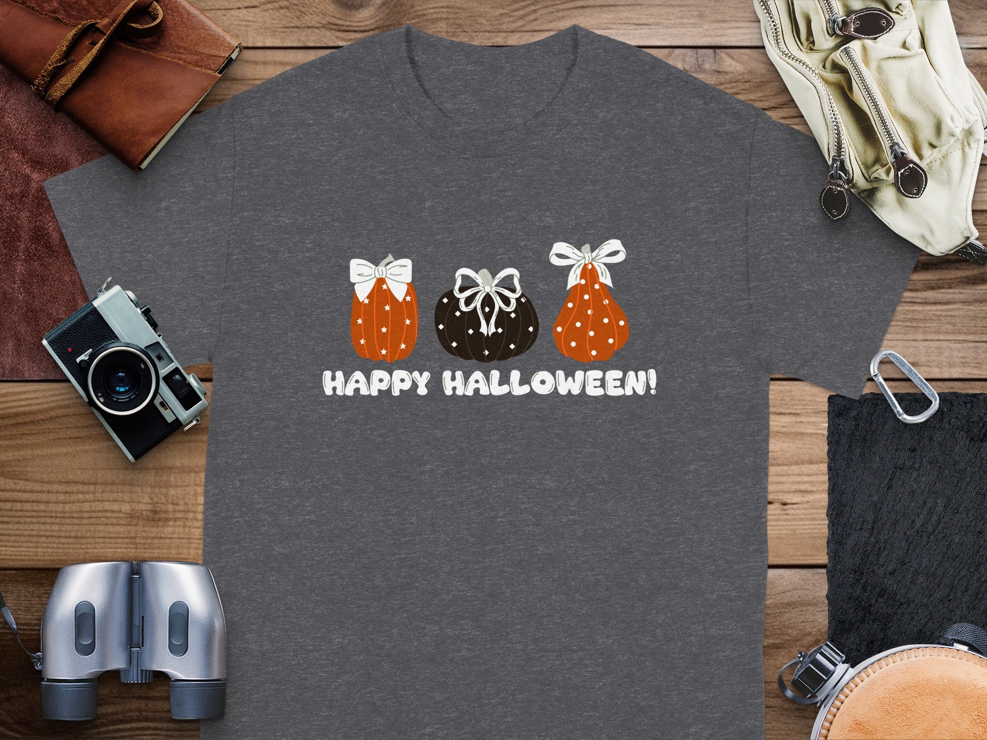 Dark grey t-shirt with three decorated pumpkins and "Happy Halloween!" text.