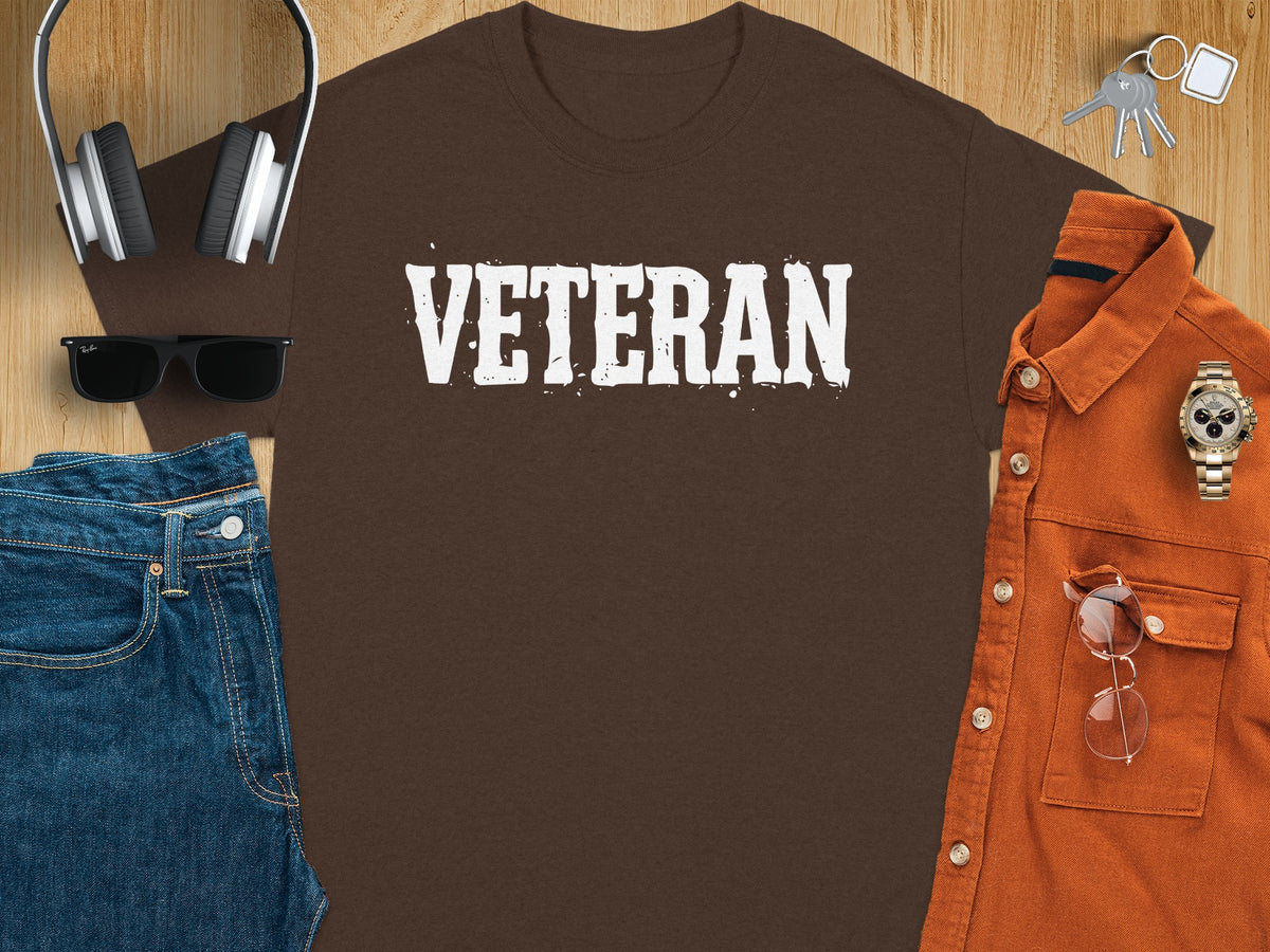Brown t-shirt with white distressed "VETERAN" text.