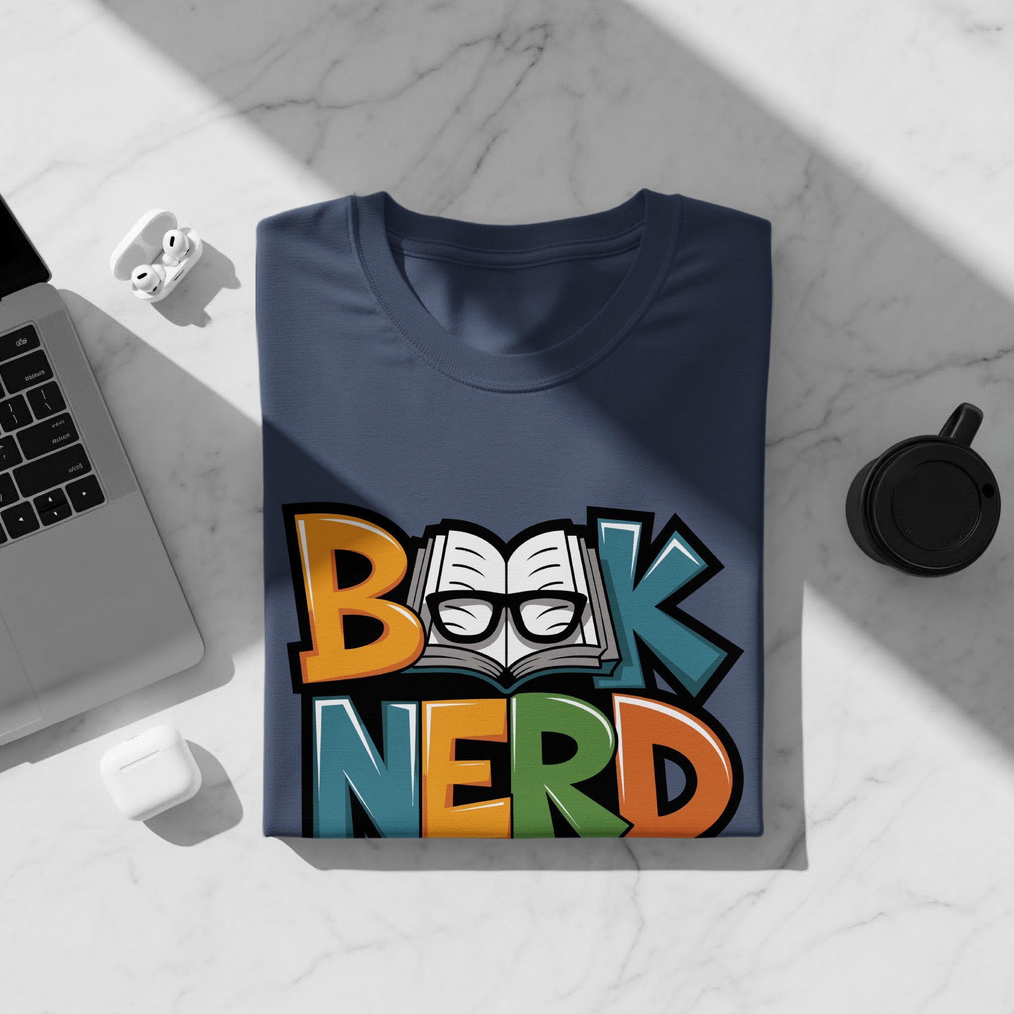 Navy t-shirt with colorful "Book Nerd" text, open book and glasses graphic.