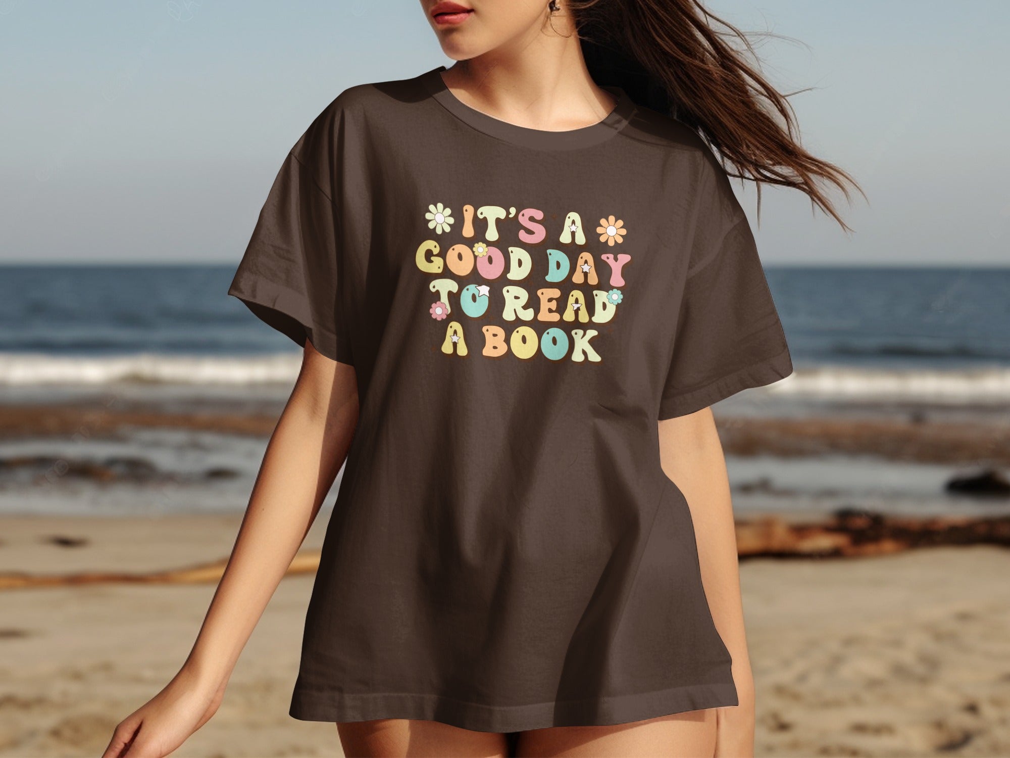 Brown t-shirt with "It's a good day to read a book" in colorful lettering.