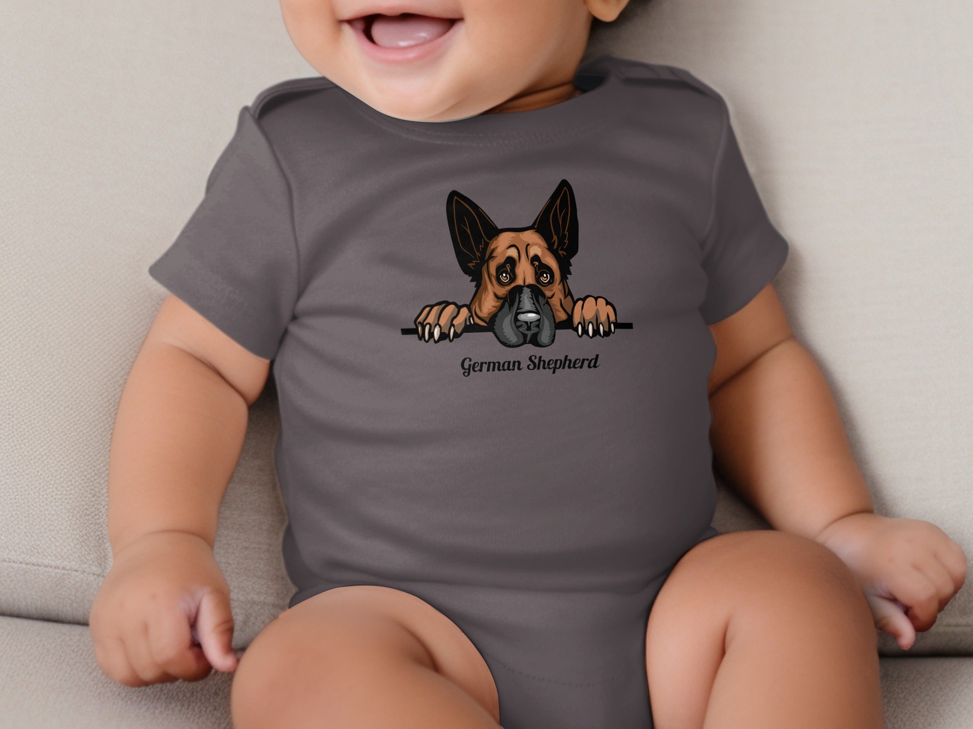 Baby wearing a grey bodysuit with a German Shepherd graphic and text.