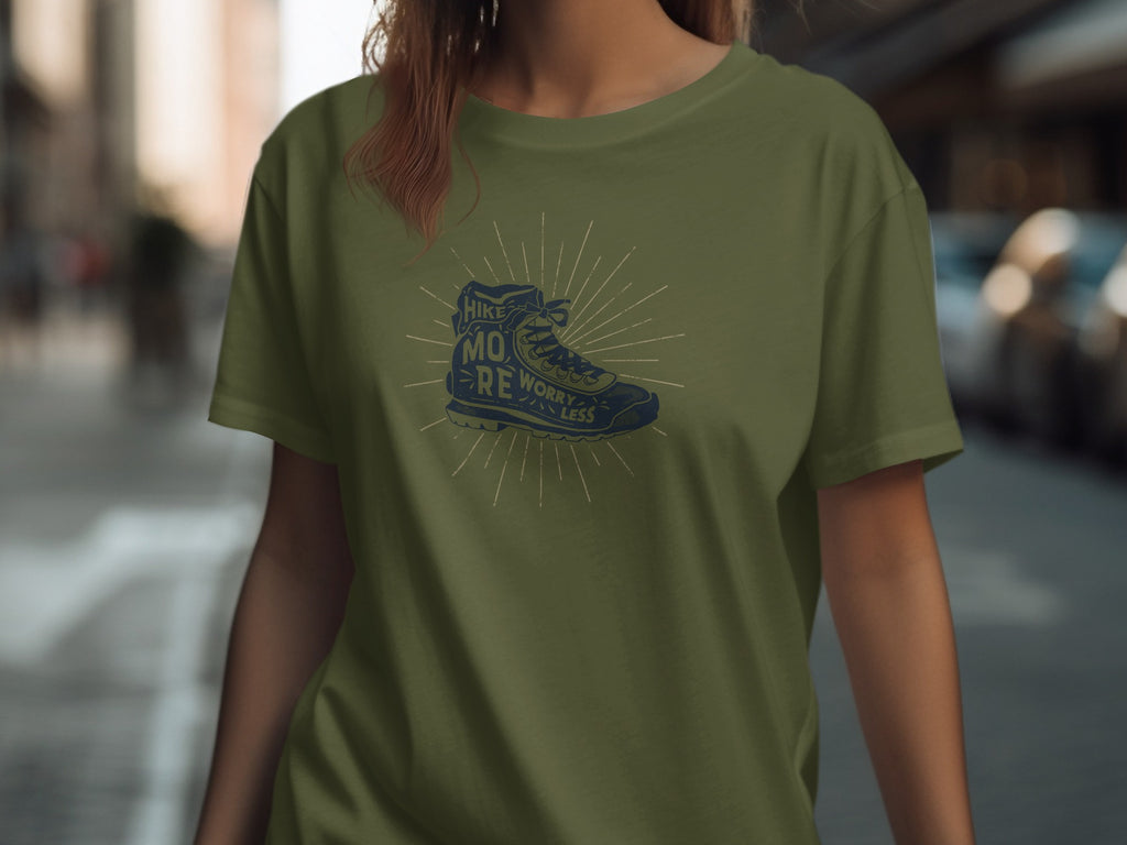 Olive t-shirt with vintage hiking boot graphic and text "Hike More Worry Less".