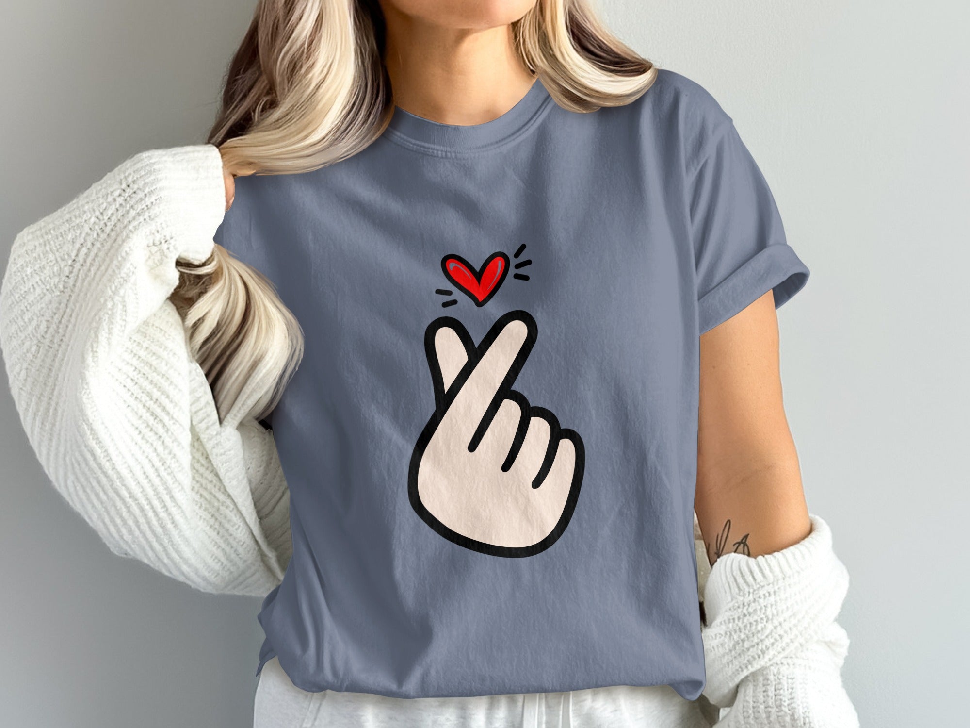 Gray t-shirt featuring a cartoon finger heart gesture with a red heart above.