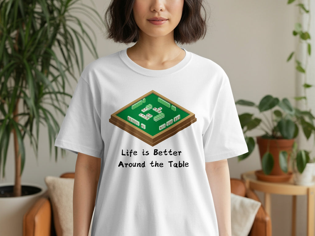 White t-shirt with graphic of mahjong tiles and text "Life is Better Around the Table".