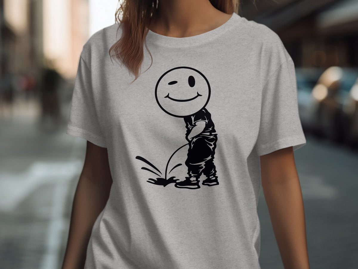 Light grey t-shirt with a black graphic of a winking smiley face urinating.