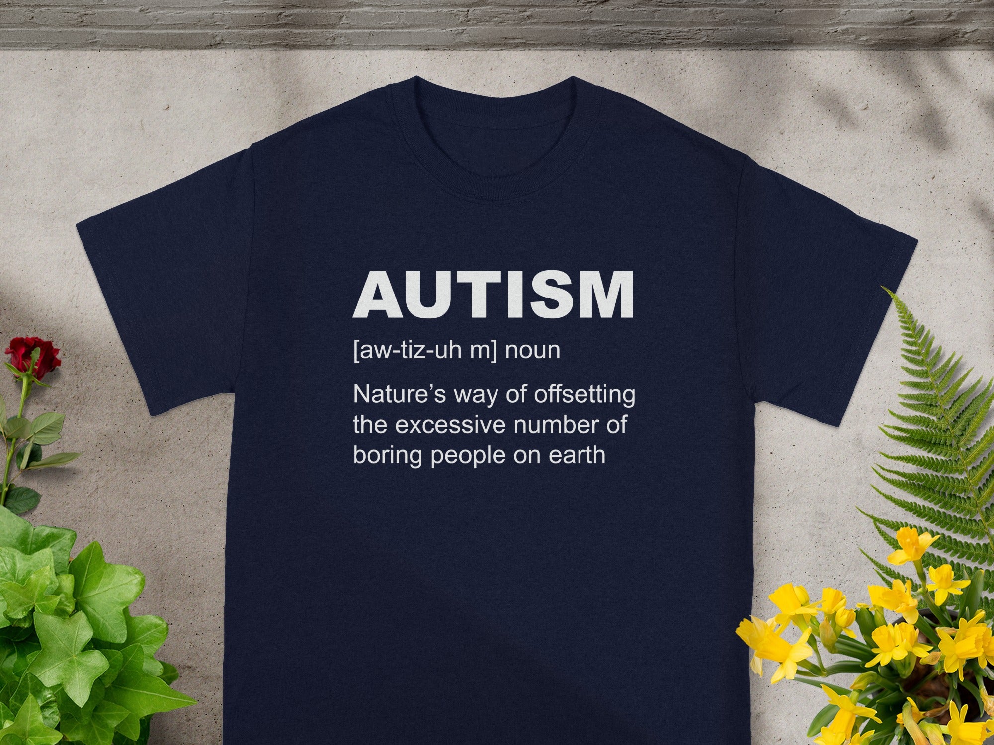 Navy t-shirt with text: AUTISM [aw-tiz-uh m] noun Nature's way of offsetting the excessive number of boring people on earth