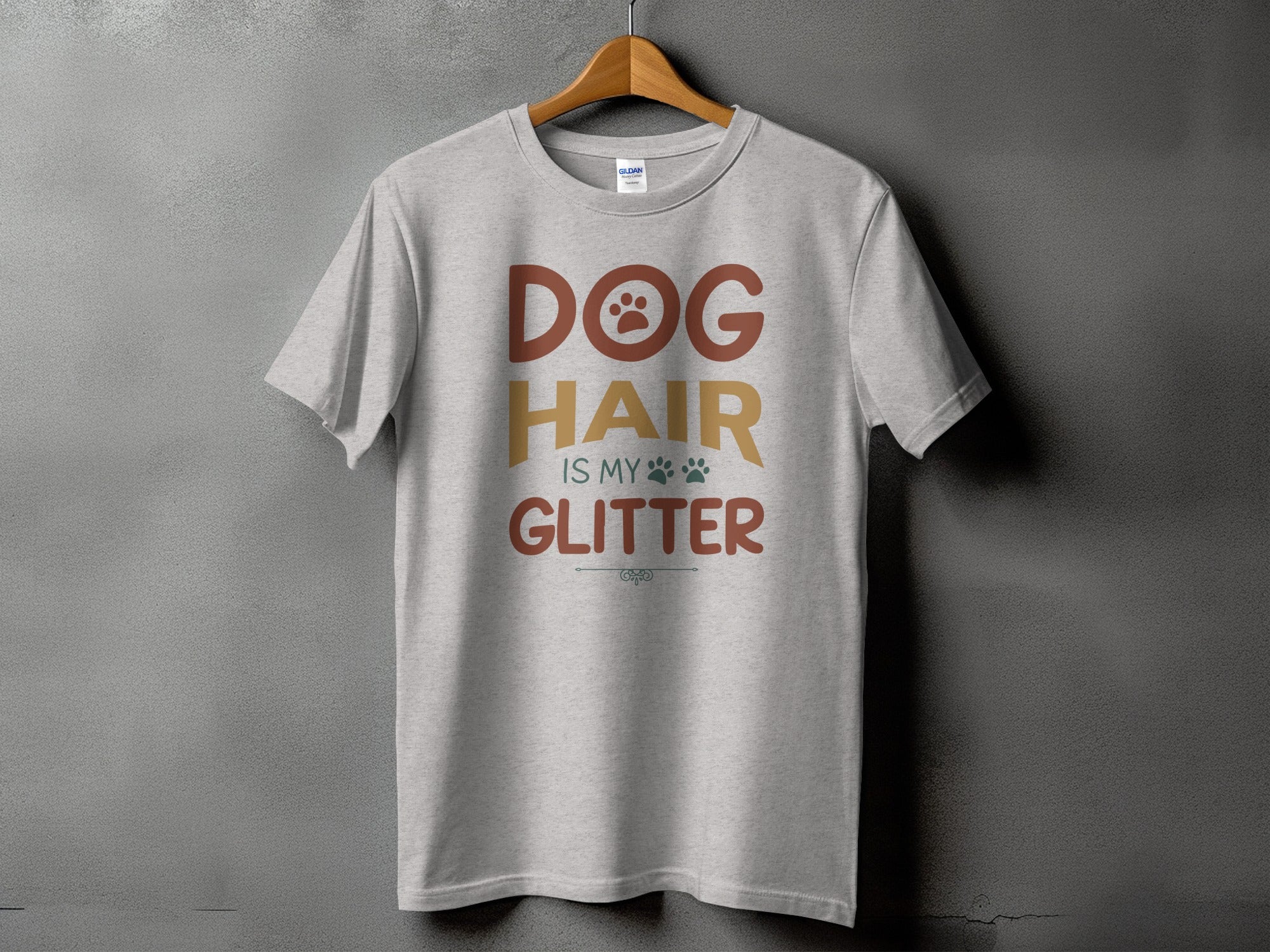 Grey t-shirt with text "DOG HAIR IS MY GLITTER" and paw prints.