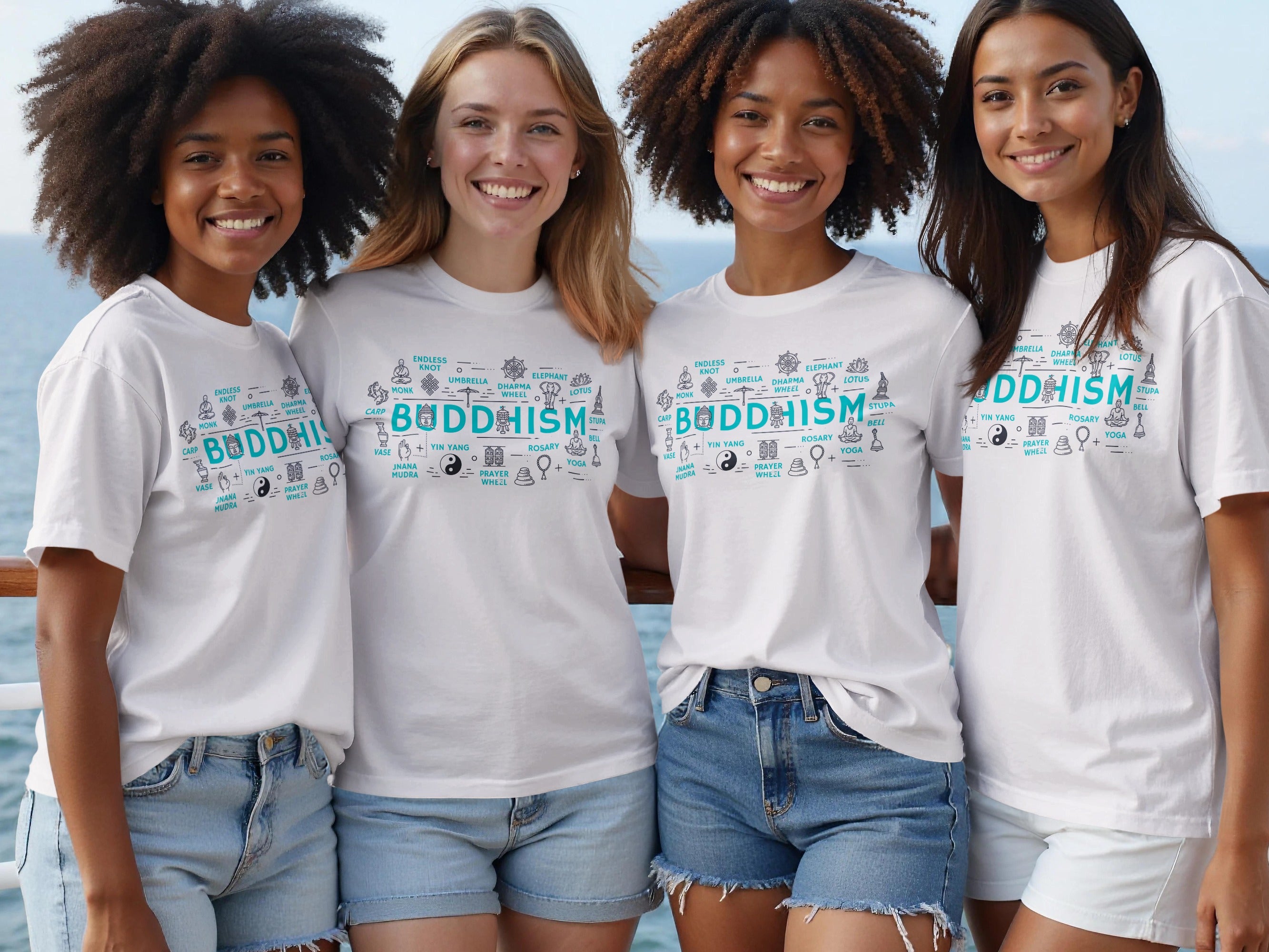 Four smiling women wear white t-shirts with a "Buddhism" graphic and associated symbols.