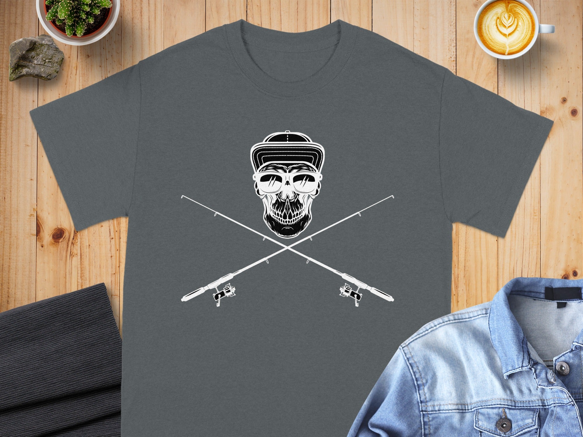 Skull wearing sunglasses and a cap superimposed over crossed fishing rods.