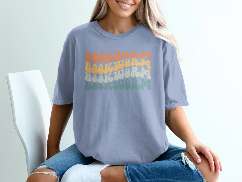 Light blue t-shirt with "BOOKWORM" in stacked retro fonts.