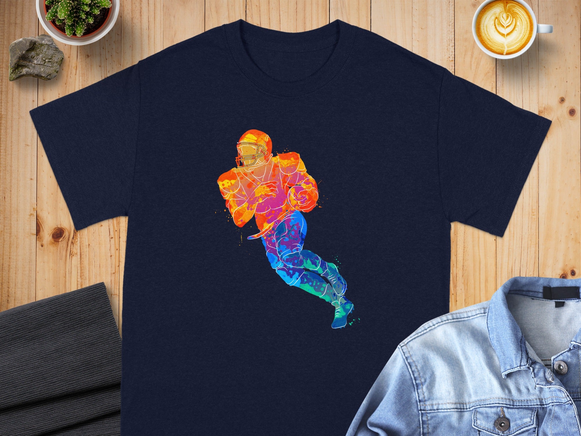 Navy t-shirt featuring a colorful watercolor football player graphic.