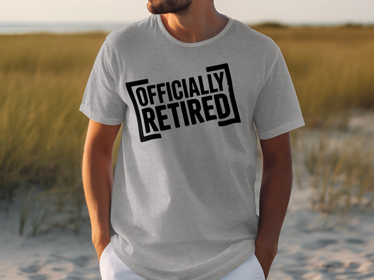 Grey t-shirt with black text "OFFICIALLY RETIRED" in a box.