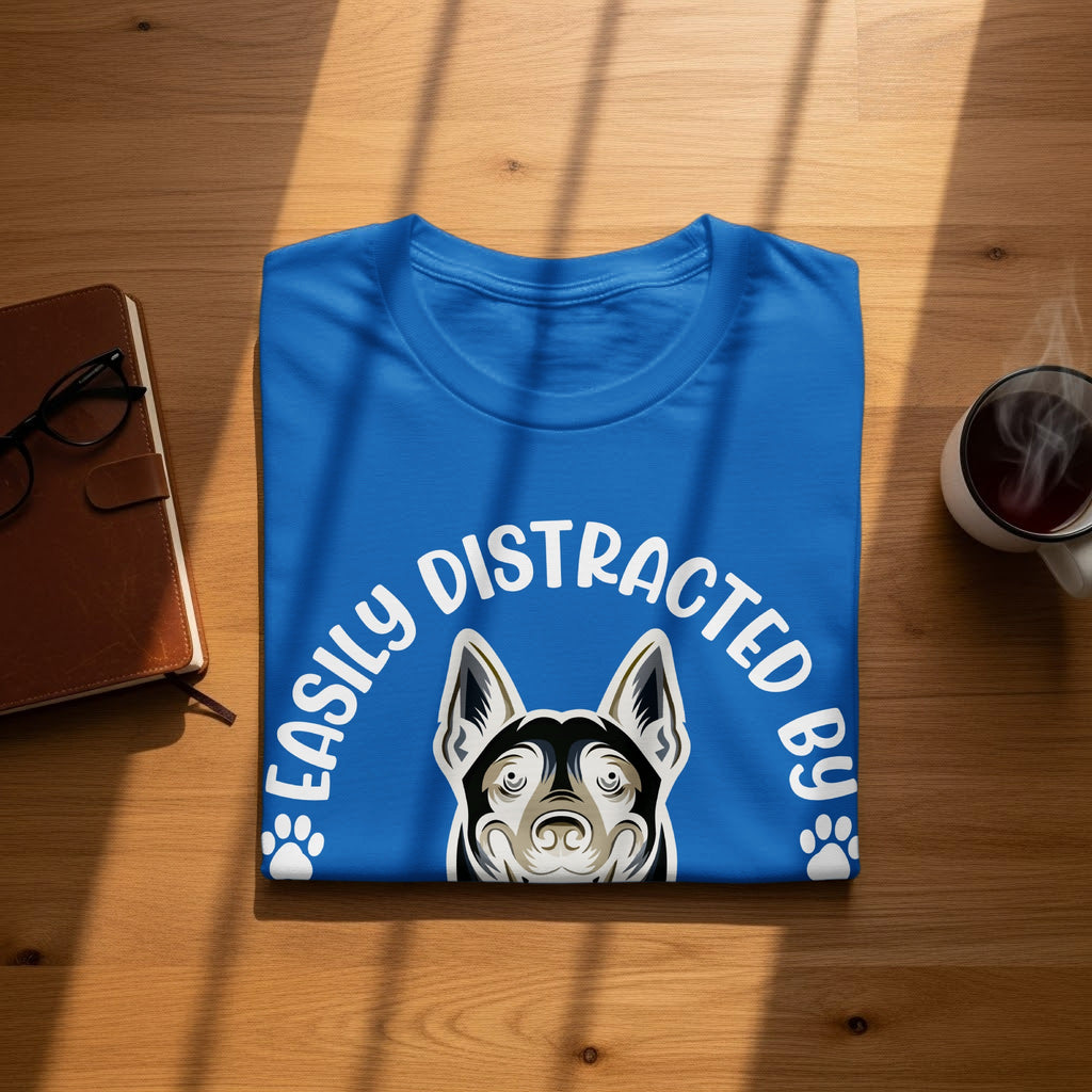 Blue t-shirt with dog illustration and text "Easily Distracted By".