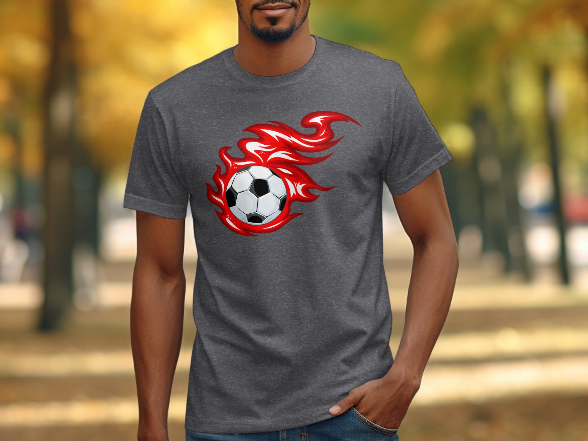 Soccer ball with red flames graphic on a dark grey t-shirt.