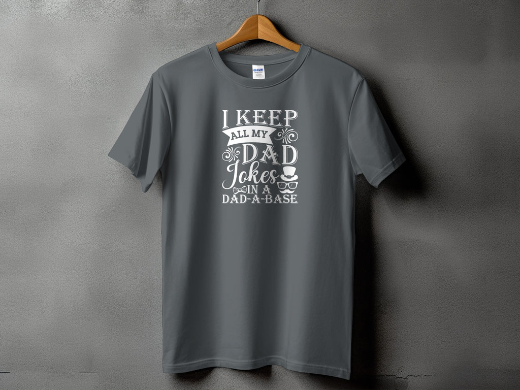 Gray t-shirt with white text "I keep all my dad jokes in a dad-a-base" and graphics.