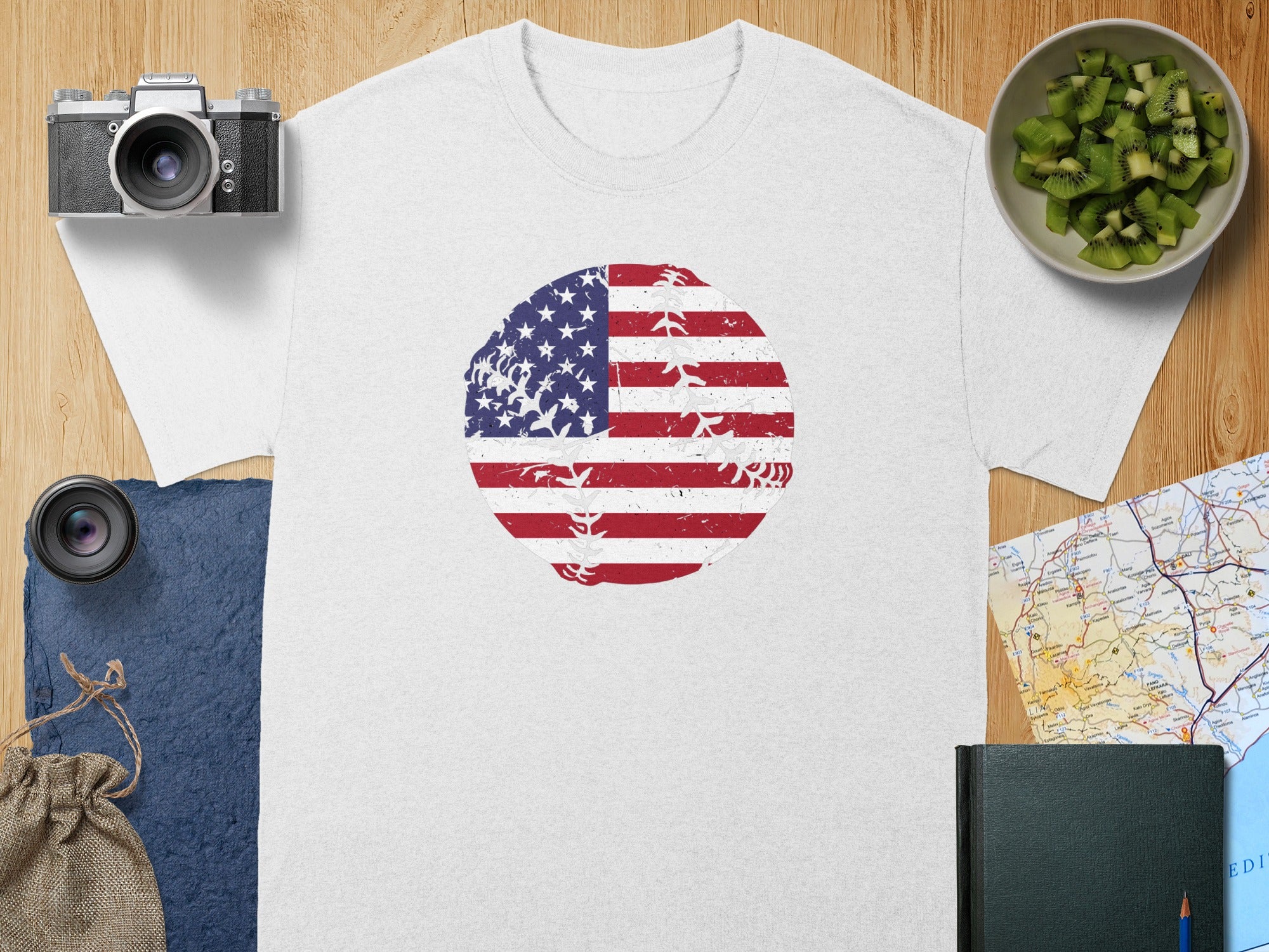 White t-shirt with circular distressed US flag baseball graphic.