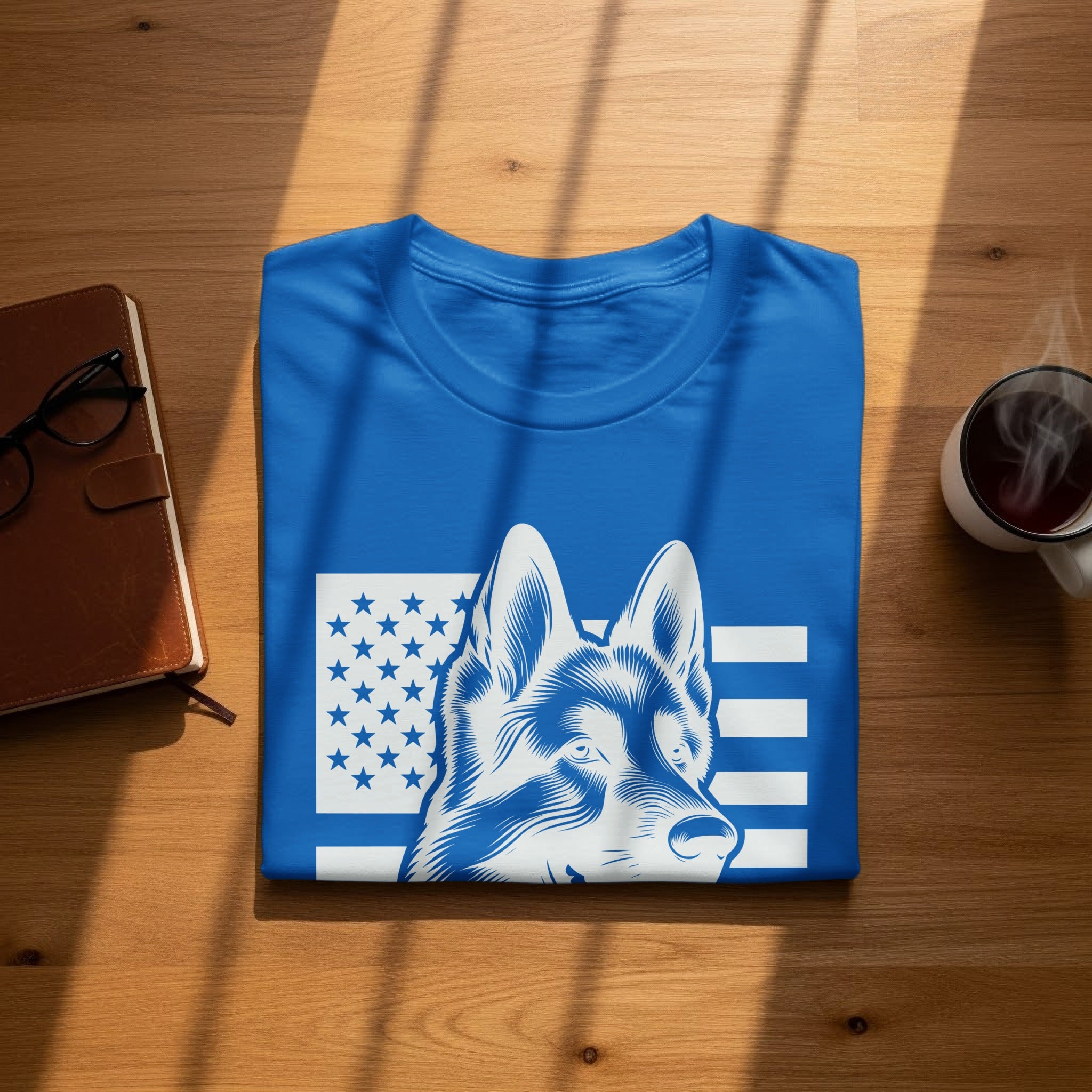 Blue t-shirt with a blue and white dog and American flag design.