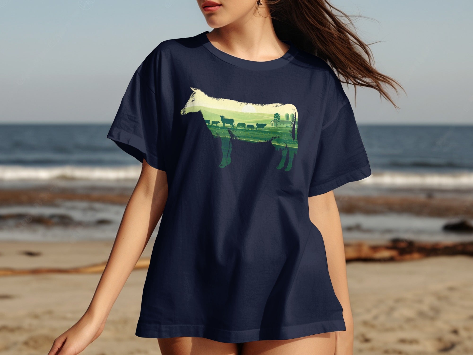 Navy t-shirt with a silhouette of a cow filled with a pastoral landscape and farm scene.