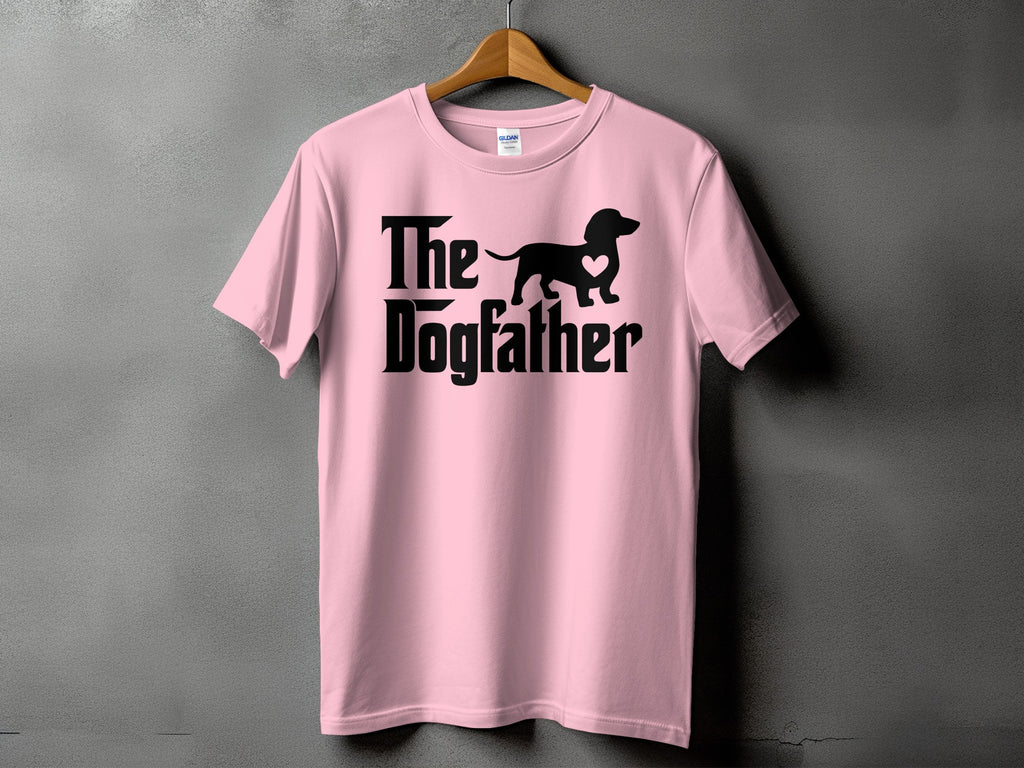 Pink t-shirt with black text and dachshund silhouette saying "The Dogfather".