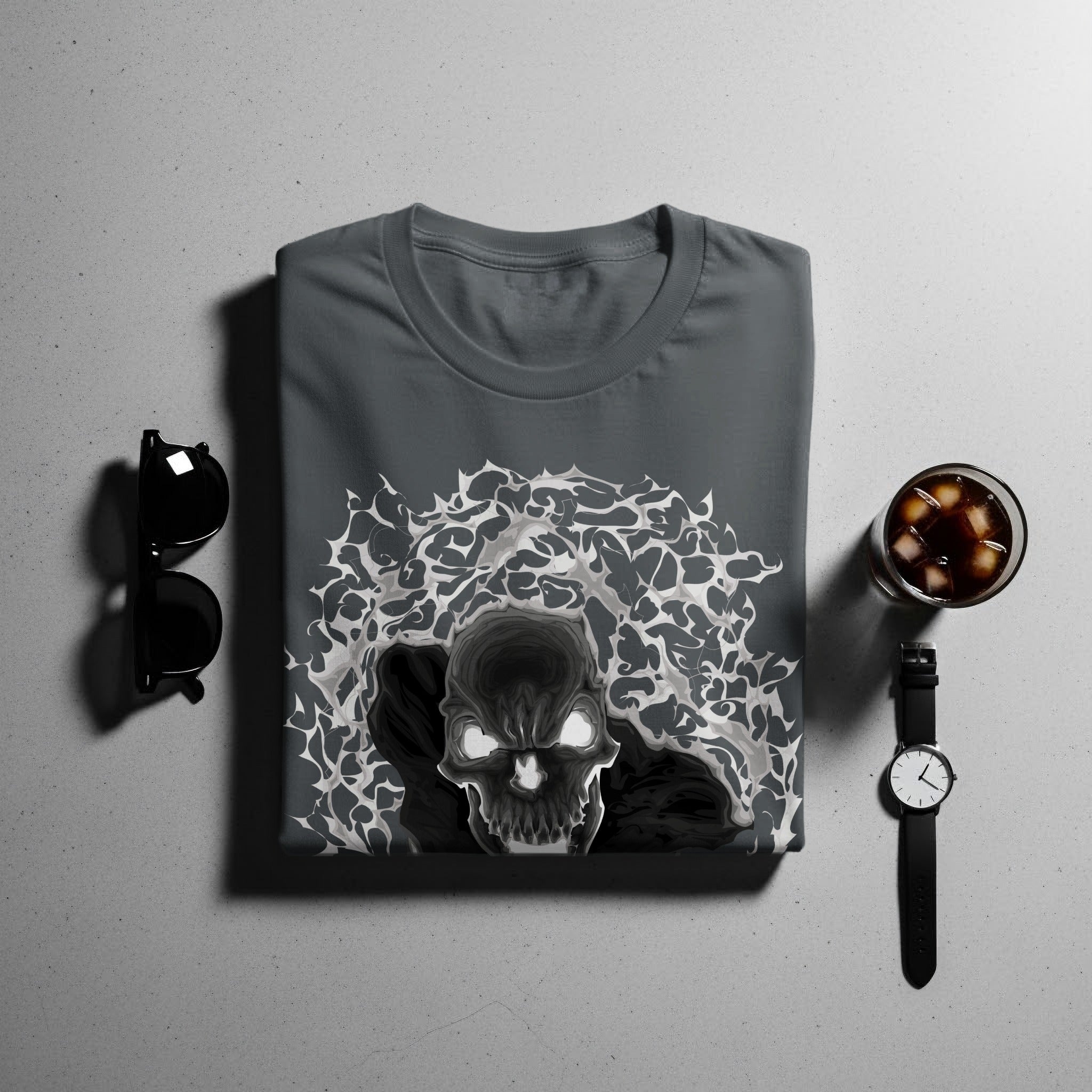 Dark gray t-shirt with a stylized skull graphic and abstract elements