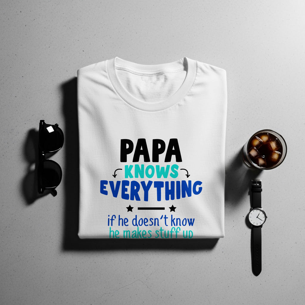 White t-shirt with "PAPA KNOWS EVERYTHING" and "if he doesn't know he makes stuff up" text.