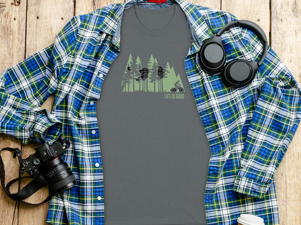 Grey t-shirt with green forest and cyclist graphic saying "LIFE IS GOOD".