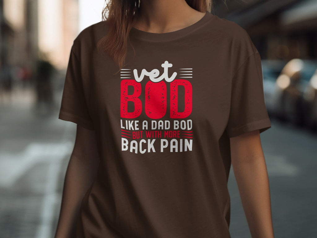 Brown t-shirt with white and red text: "vet BOD LIKE A DAD BOD BUT WITH MORE BACK PAIN"