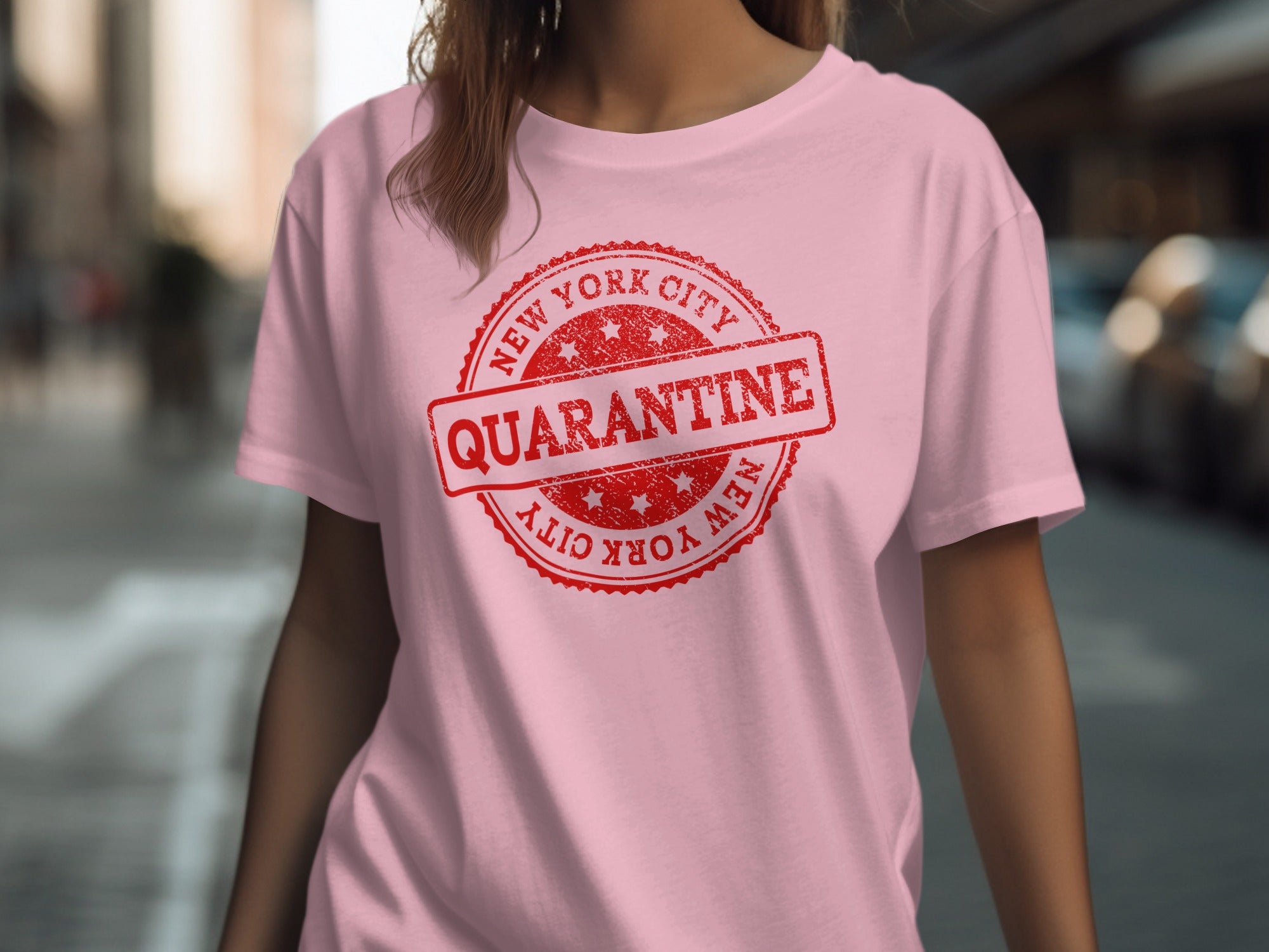 Pink t-shirt with red New York City Quarantine stamp graphic.