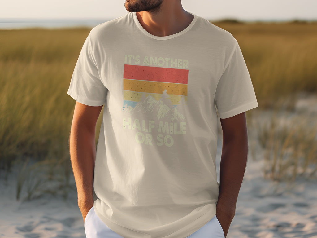 T-shirt with vintage sunset mountain graphic and "It's another half mile or so" text.