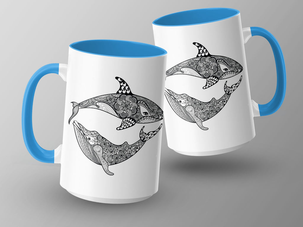 Two white mugs with blue handles feature black line art of whales and orcas.