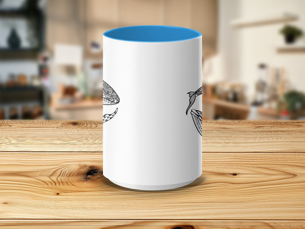 White mug with blue interior featuring a black mandala whale design.
