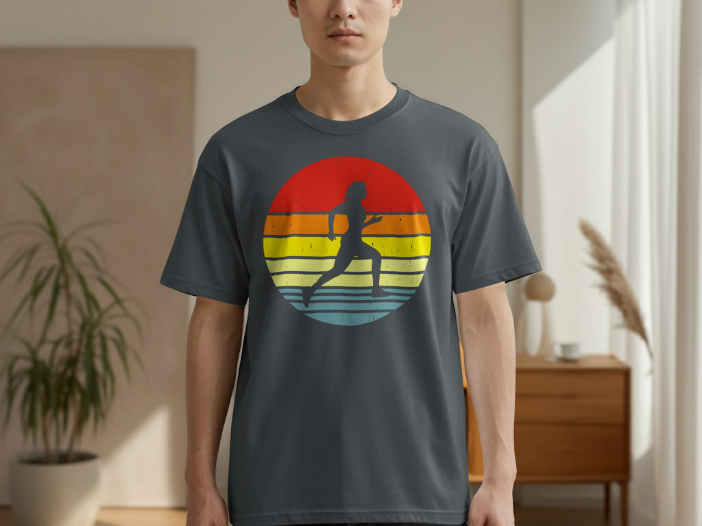 Silhouette of a runner against a circular, striped sunset design on a t-shirt.