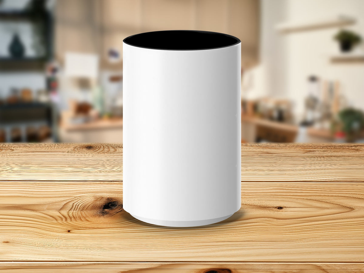 White cylindrical container with black interior on a wooden table.