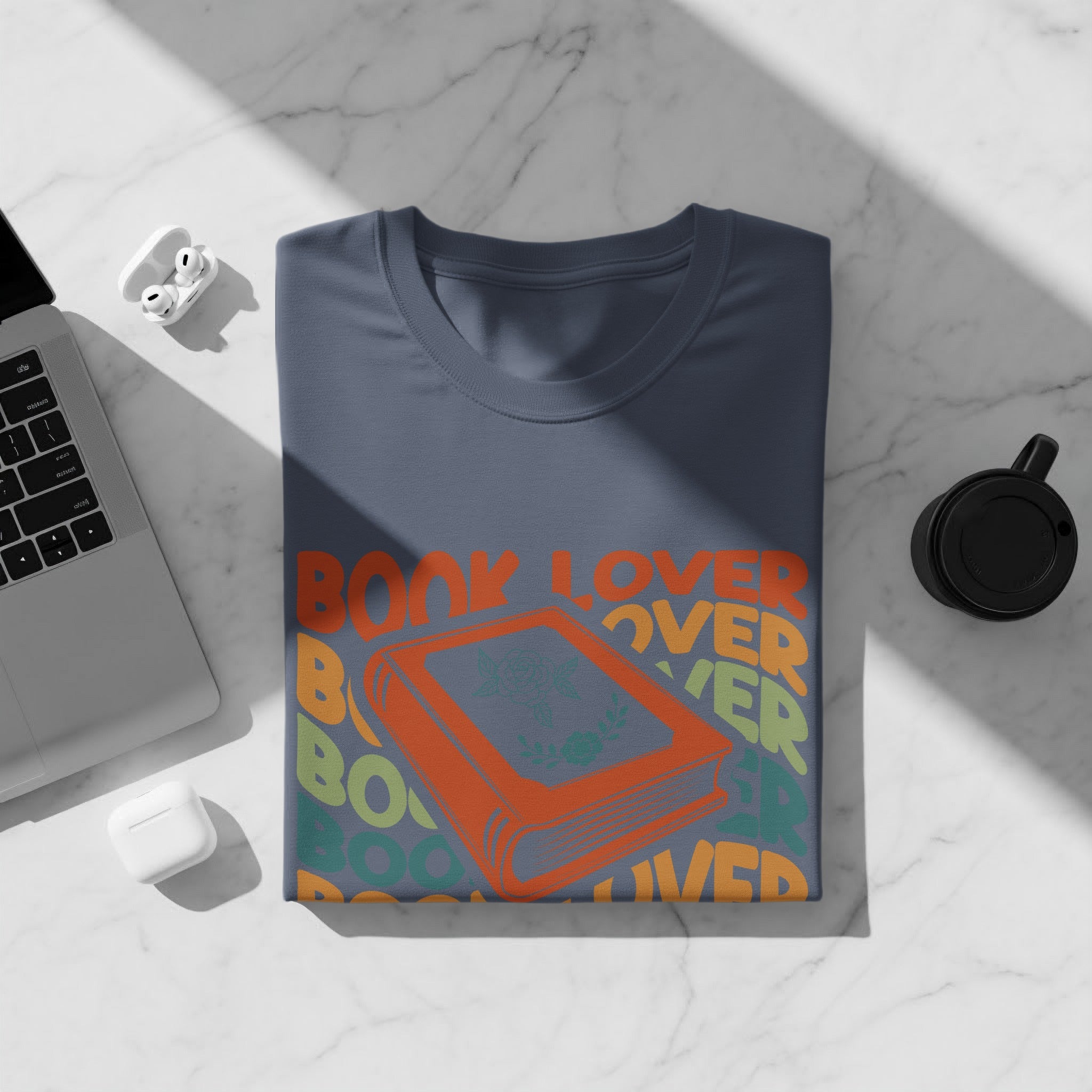 Navy t-shirt with "Book Lover" graphic and an orange book illustration.