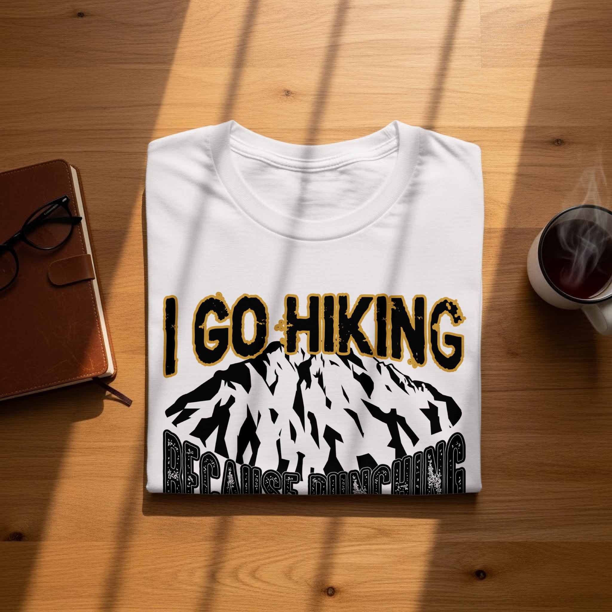 White t-shirt with "I GO HIKING BECAUSE RUNNING" design and mountain graphic.