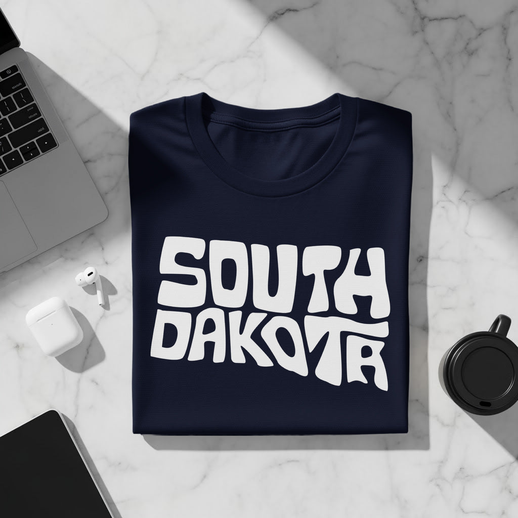 Navy t-shirt with white "SOUTH DAKOTA" text in a wavy font.