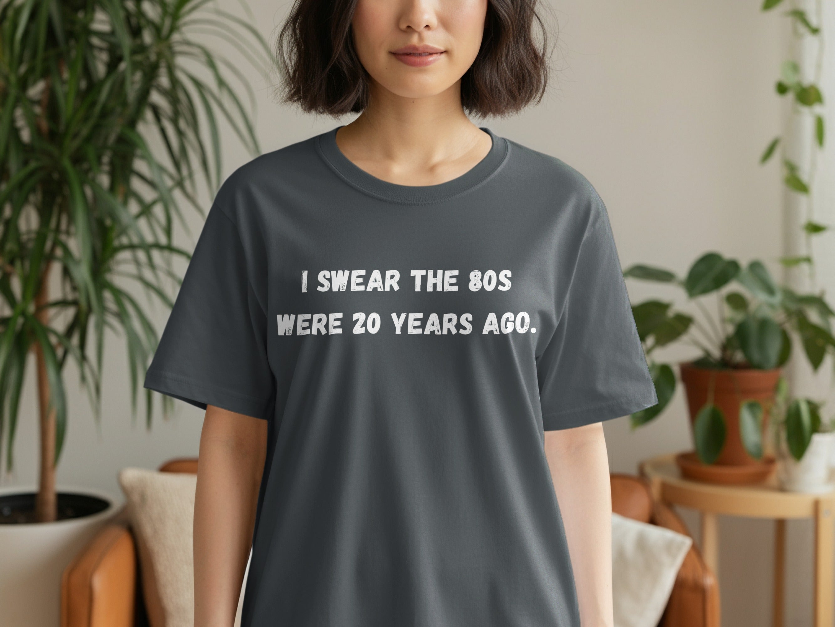 Grey t-shirt with white text "I SWEAR THE 80S WERE 20 YEARS AGO."