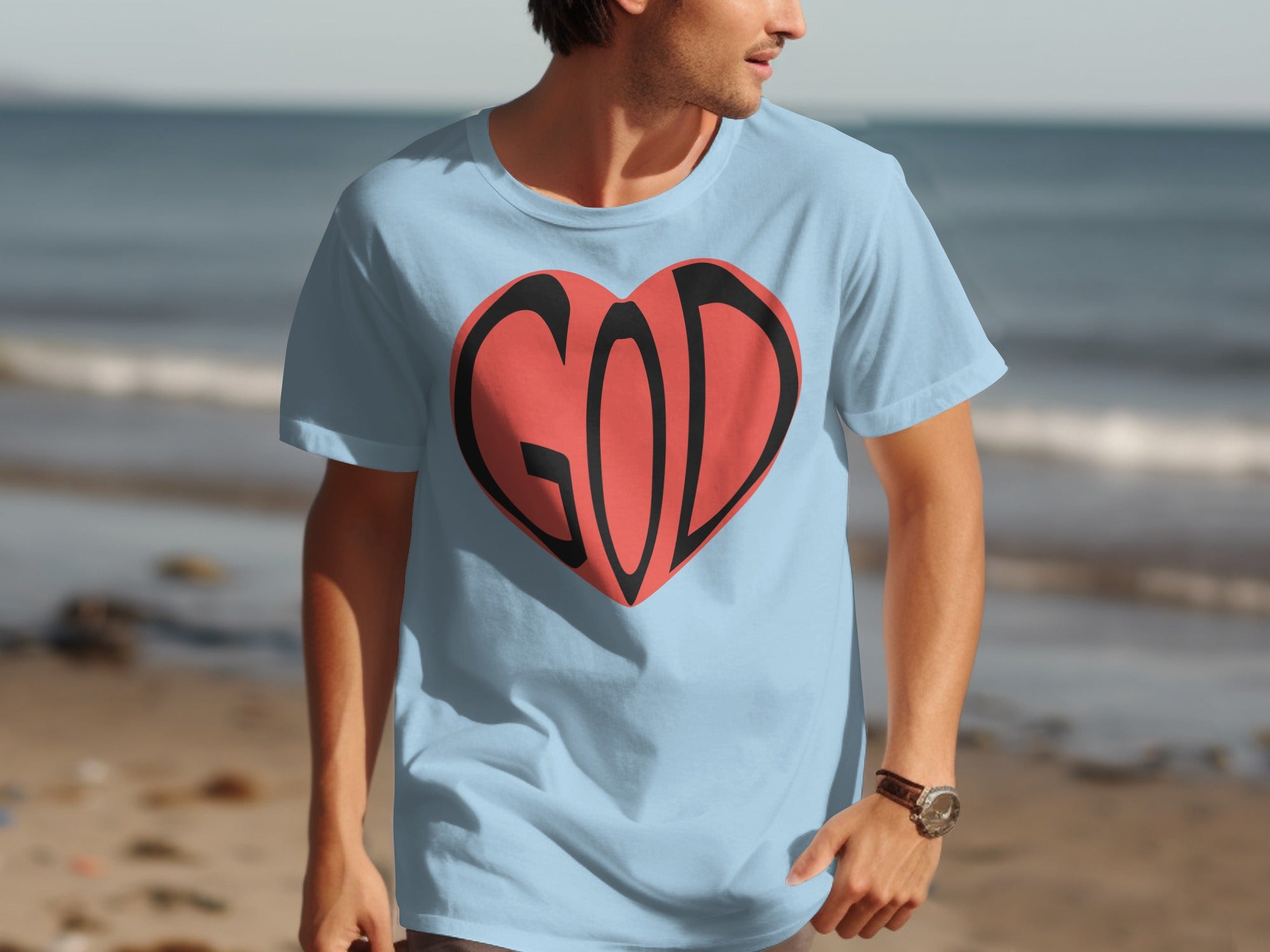 Light blue t-shirt with red heart graphic featuring the word GOD.