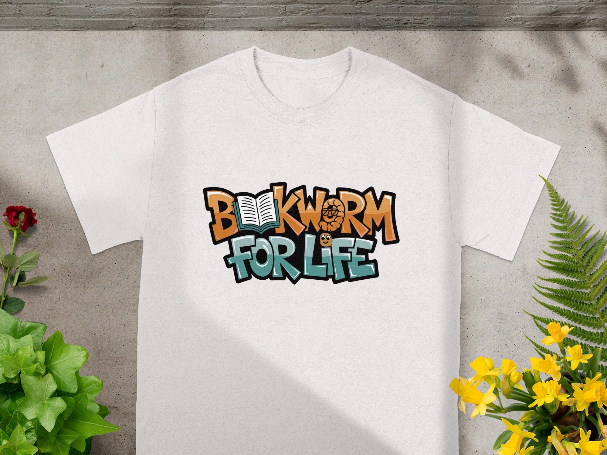White t-shirt with "Bookworm For Life" text and a book illustration.