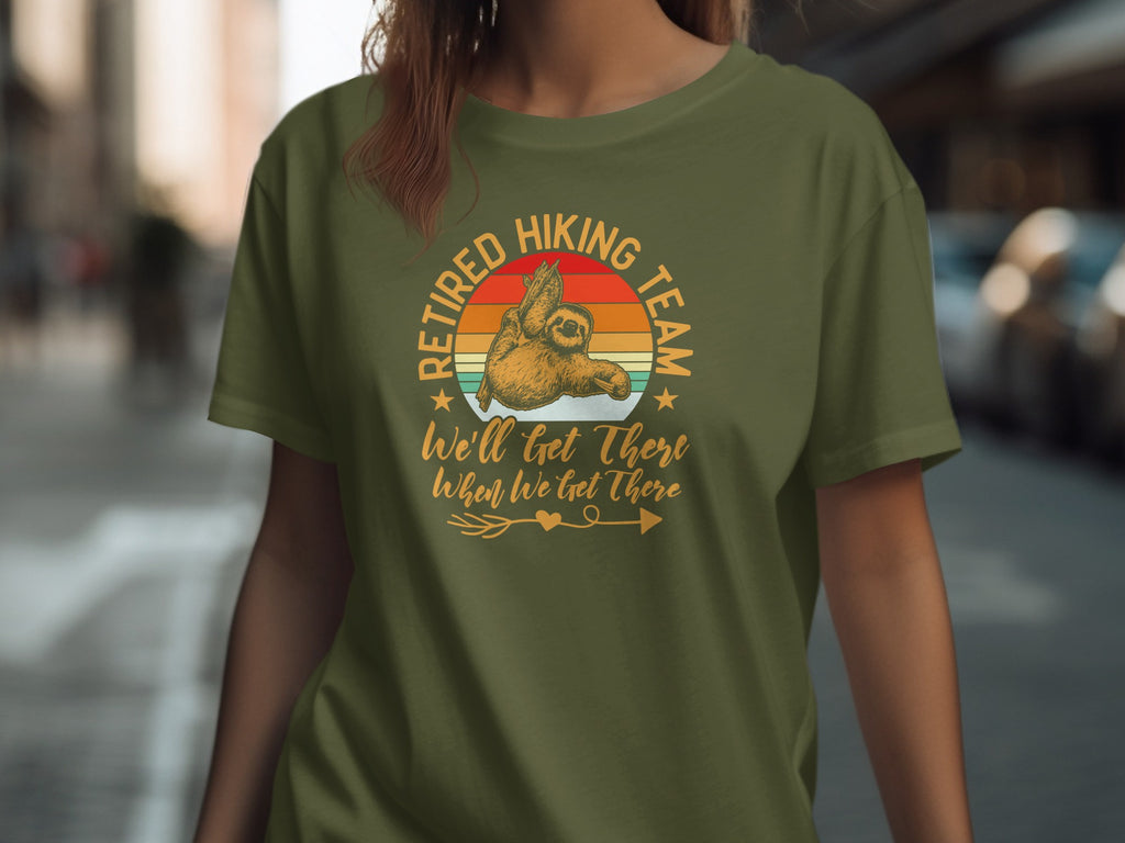 Sloth on t-shirt reads "Retired Hiking Team. We'll Get There When We Get There."