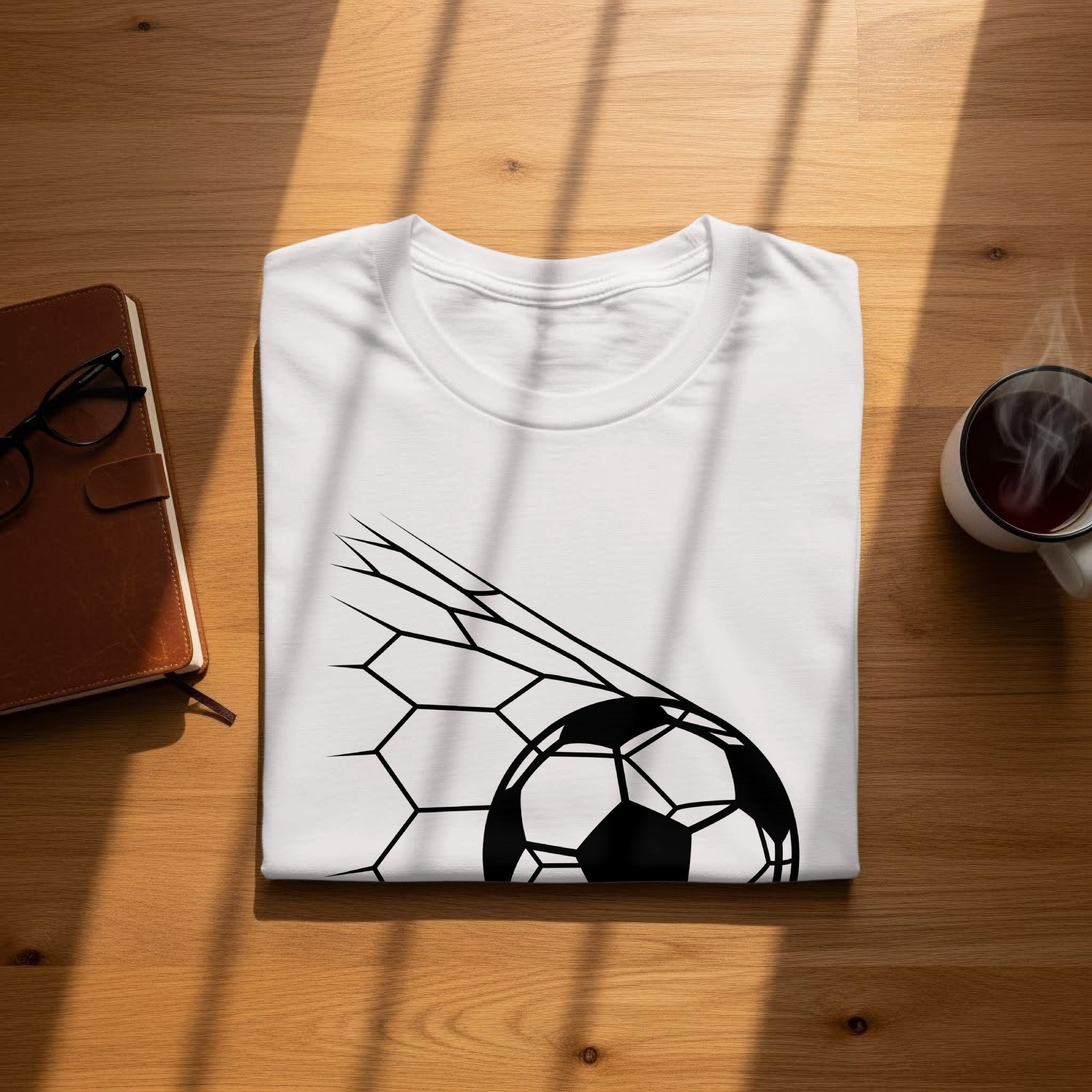 White t-shirt with a black soccer ball and net design.