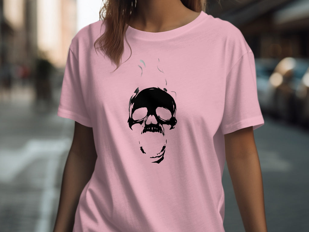 Pink t-shirt with a black screaming skull graphic and smoke.