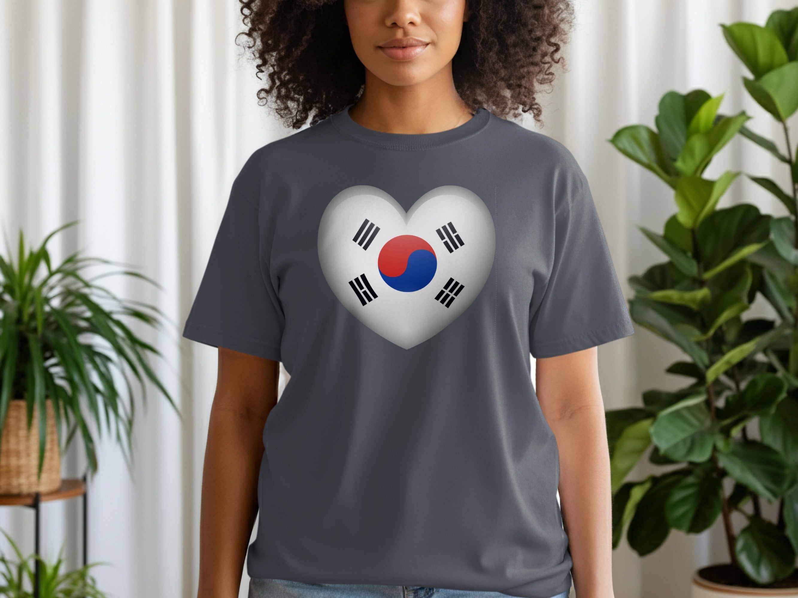 Dark grey t-shirt on a woman with a heart graphic of the Korean flag.