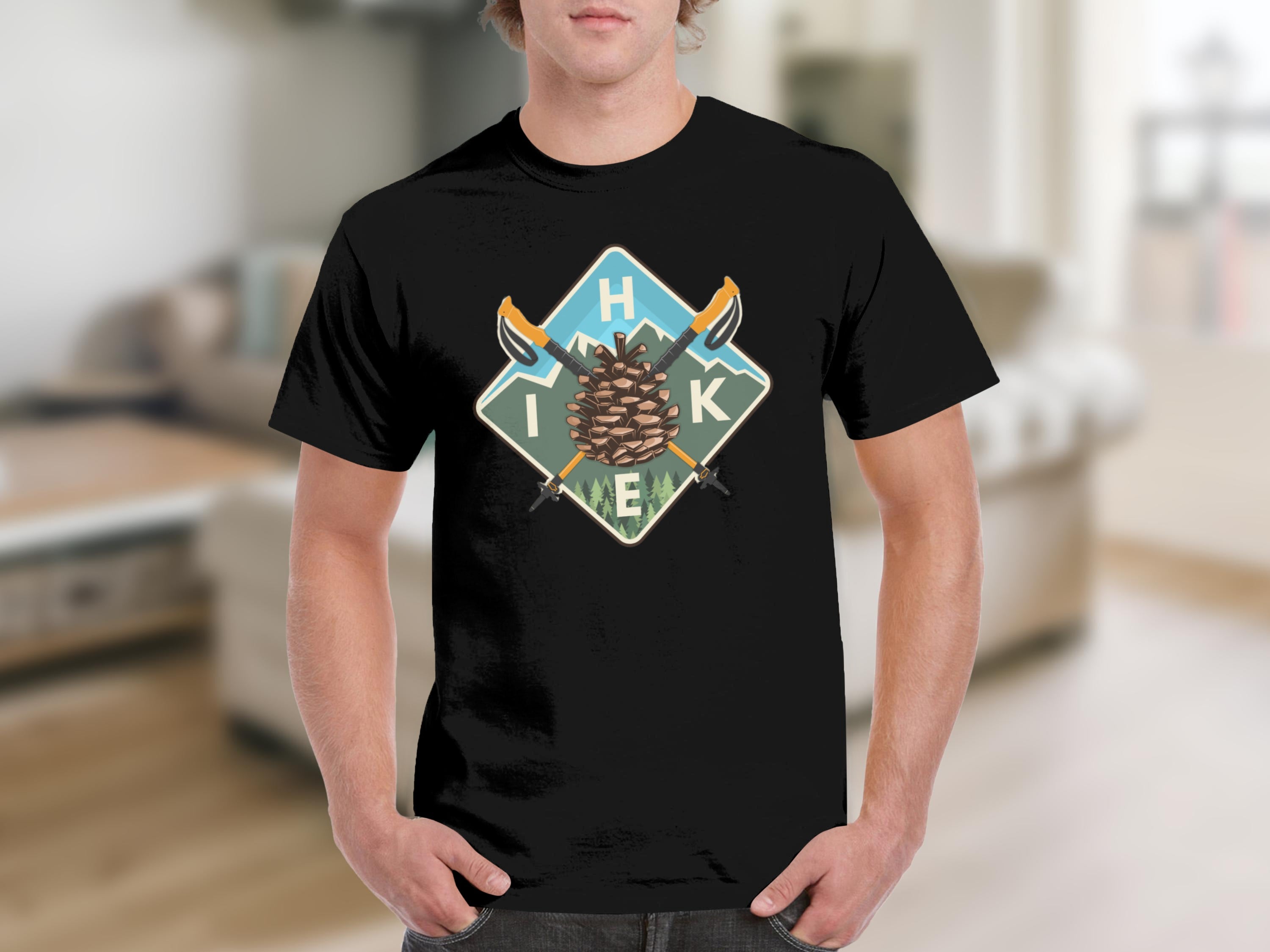 Black t-shirt with a diamond-shaped graphic featuring a pinecone, crossed hiking poles, and the word "HIKE".